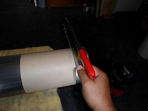 Main tube being cut to proper size - 3. (Click to go to page)