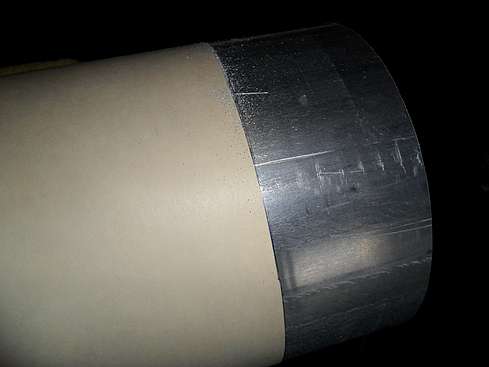 Main tube being cut to proper size - 4. (Click to go to page)