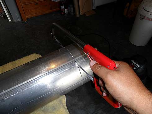 Main tube being cut to proper size - 9. (Click to go to page)