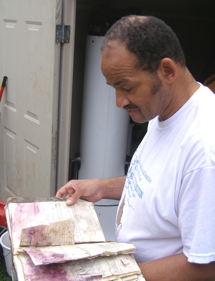 Gary Barabino surveys the damaged 1976 volume of the VAO Astronomical Journal.