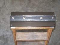 The under side of the completed dovetail plate showing the dovetail bar installed.